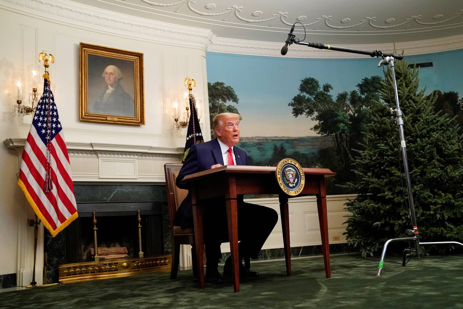 U.S. President Donald Trump participates in a Thanksgiving video teleconference with members of the military forces