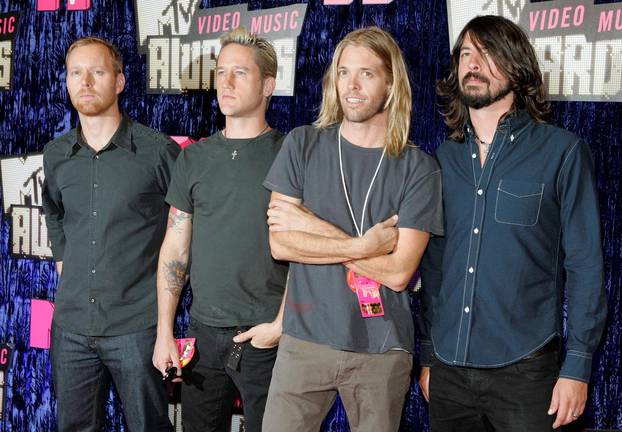 FILE PHOTO: Nate Mendel, Chris Shiflett, Taylor Hawkins and Dave Grohl of the band "Foo Fighters" arrive for the 2007 MTV Video Music Awards in Las Vegas