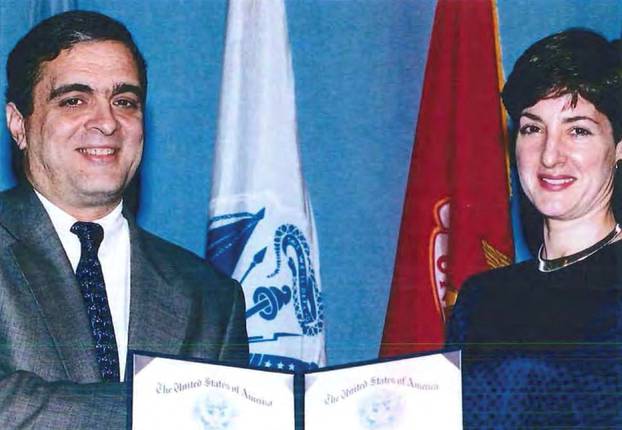 An undated handout image shows Ana Belen Montes receiving a national intelligence certificate of distinction from George Tenet