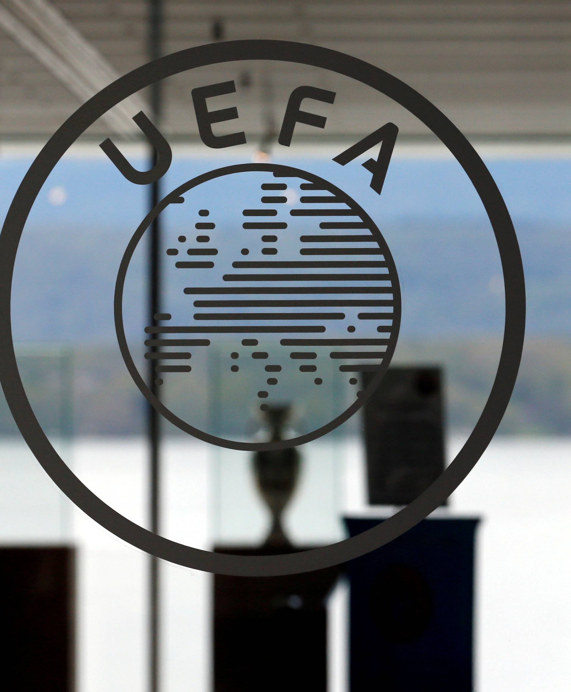 FILE PHOTO: A logo is pictured on UEFA headquarters in Nyon