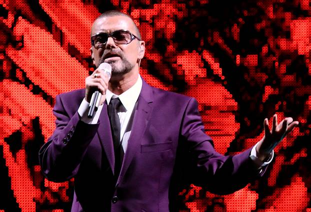 FILE PHOTO British singer George Michael performs on stage during his "Symphonica" tour concert in Vienna