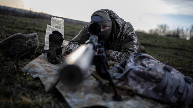 Ukrainian Army sniper practices with shooting at a firing range near a front line in Donetsk region