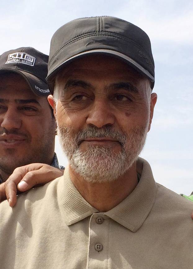 FILE PHOTO: Iranian Revolutionary Guard Commander Qassem Soleimani stands at frontline in the town of Tal Ksaiba