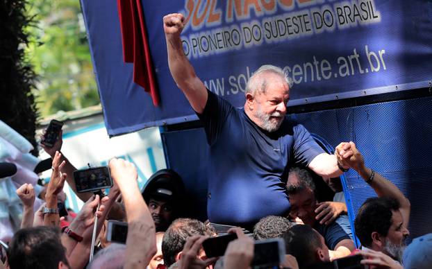 Former Brazilian President Luiz Inacio Lula da Silva is carried by supporters in front of the metallurgic trade union in Sao Bernardo do Campo