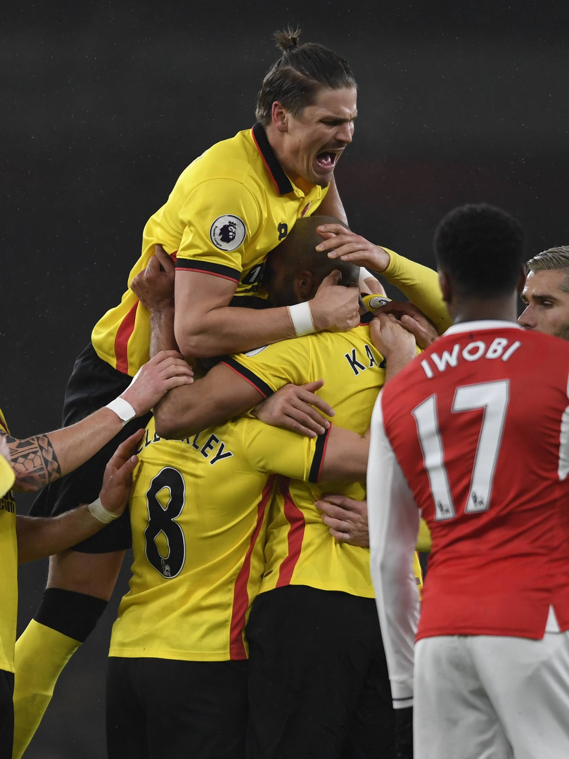 Watford's Younes Kaboul celebrates scoring their first goal with teammates