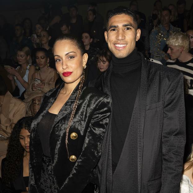 Hiba Abouk and Achraf Hakimi at BALMAIN Fall/Winter 2022-23 Runway during Paris Fashion Week - Paris, France. 02/03/2022