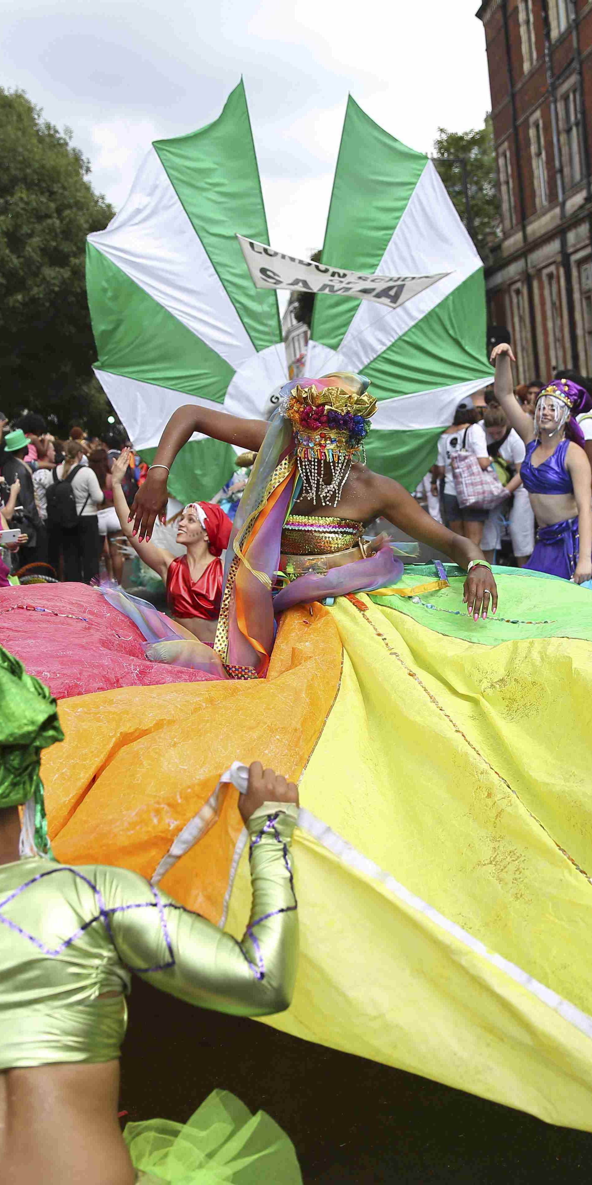 Performers participate in the parade at the Notting Hill Carnival in London