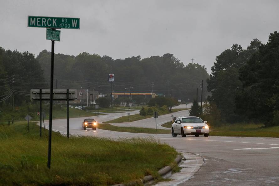 People drive along a local road as winds from Hurricane Florence hit the town of Wilson, North Carolina