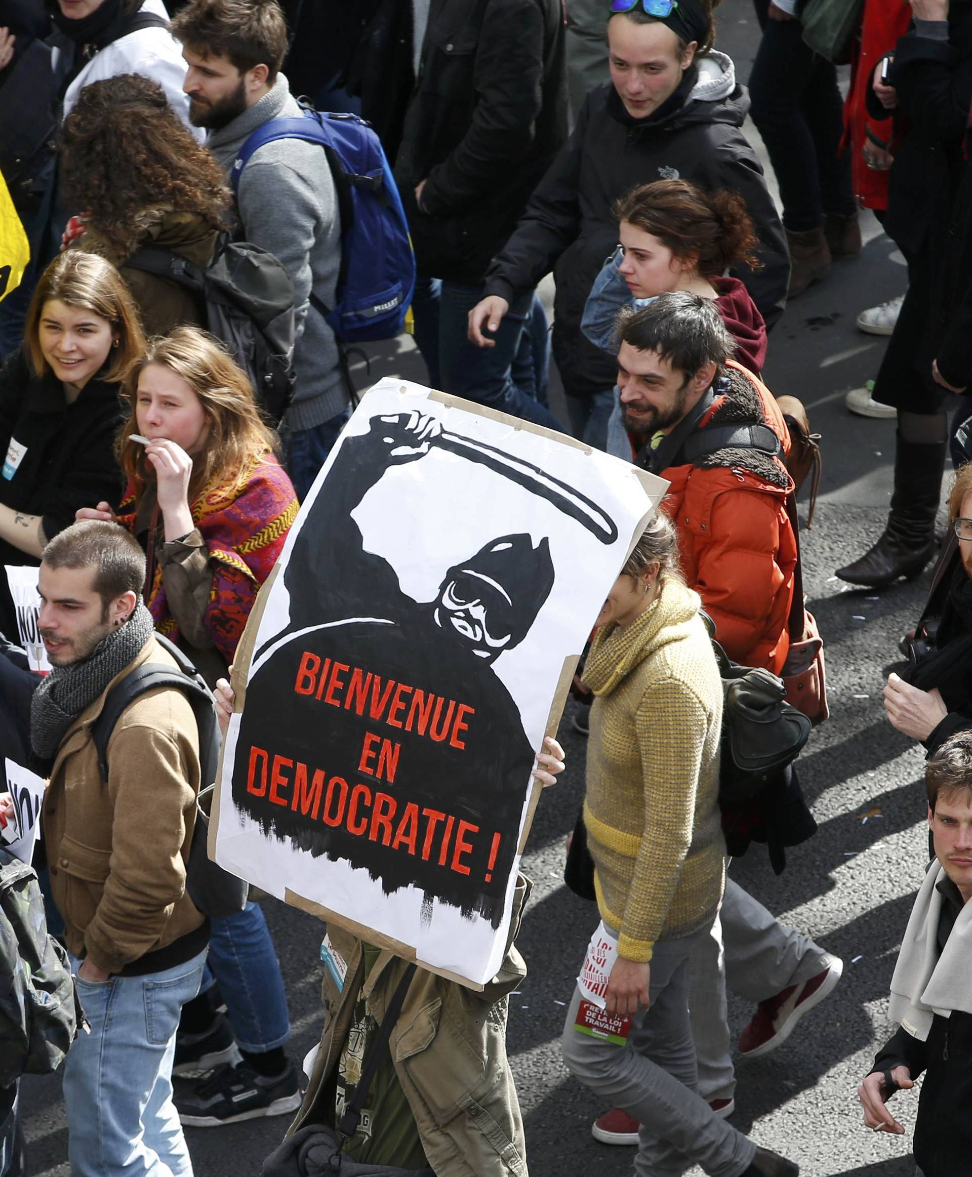 French labour union workers and students attend a demonstration against the French labour law proposal in Paris