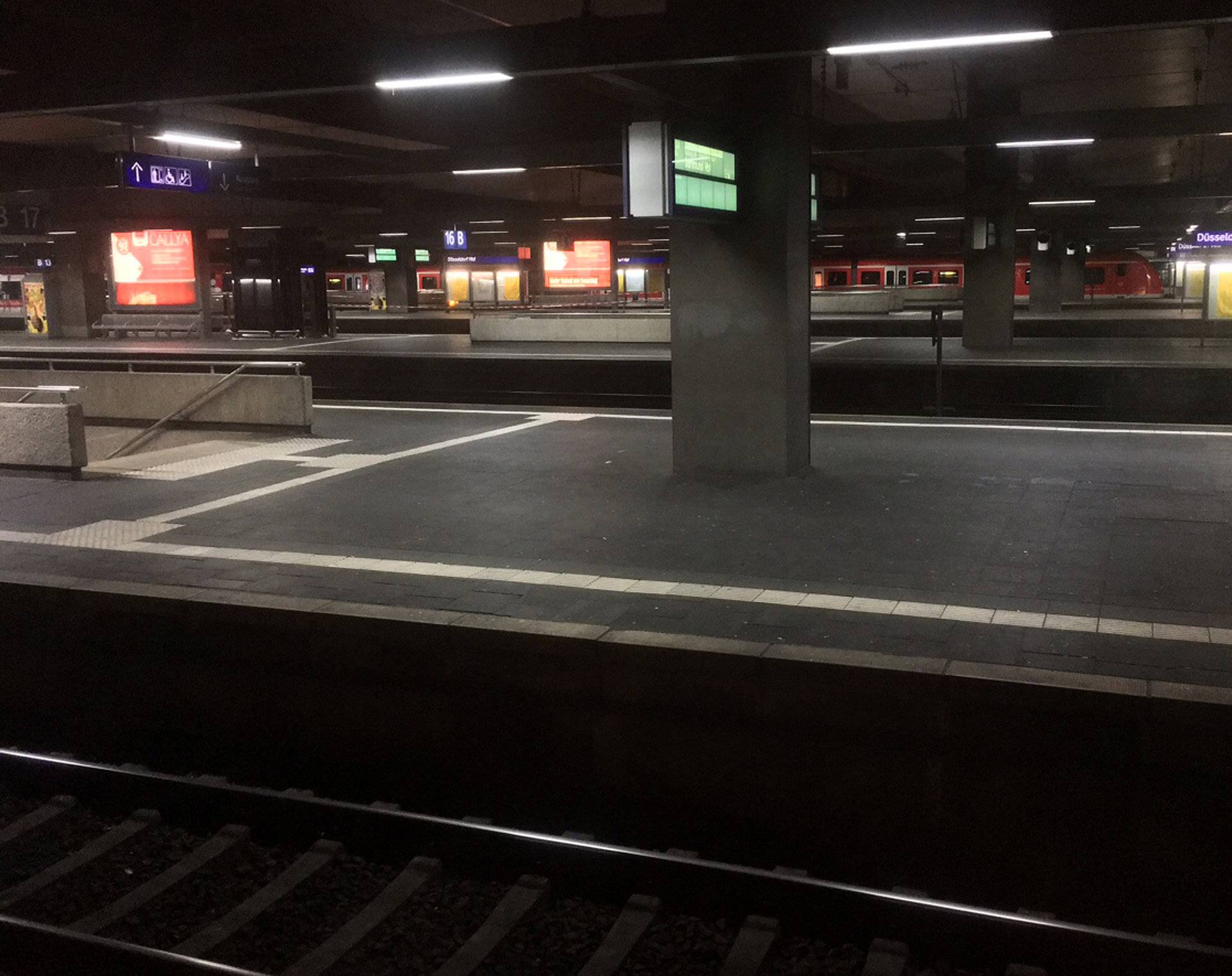 A picture taken out of a train shows empty platforms at Dusseldorf train station