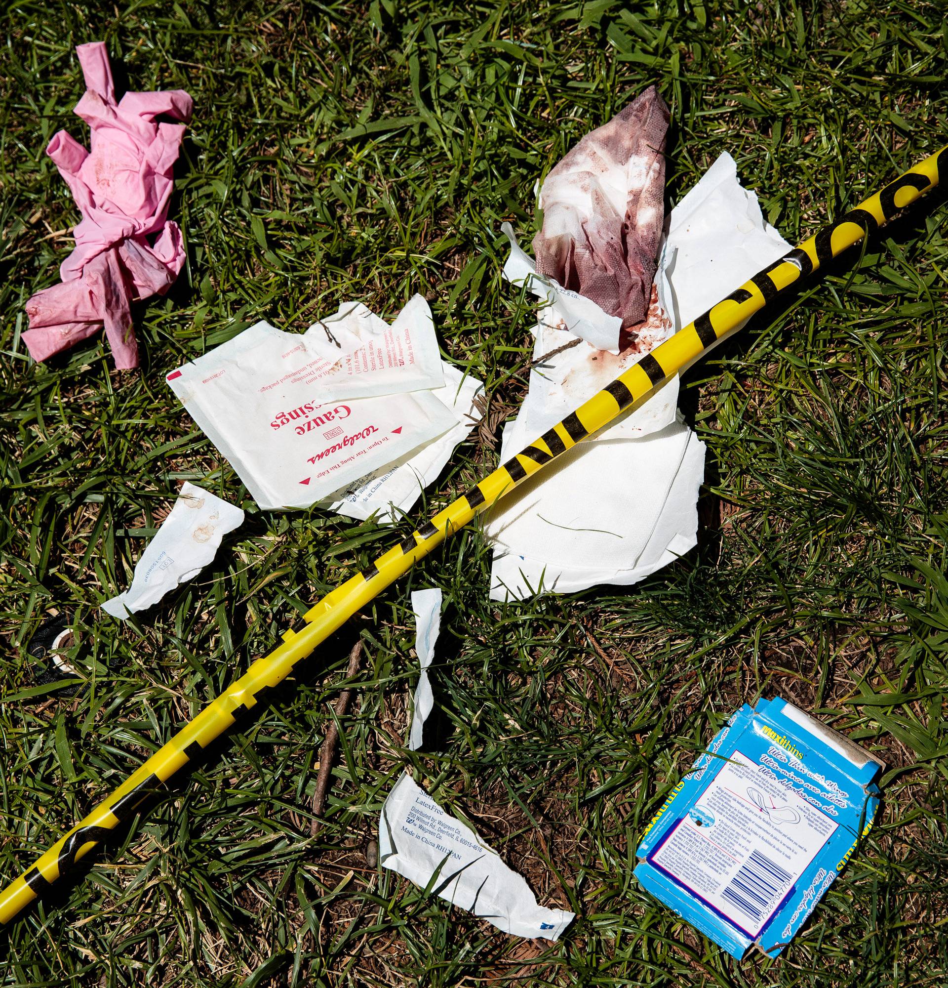 Bloody bandages and police tape lay on the lawn of the California State Capitol after multiple people were stabbed during a clash between neo-Nazis holding a permitted rally and counter-protestors on Sunday in Sacramento.