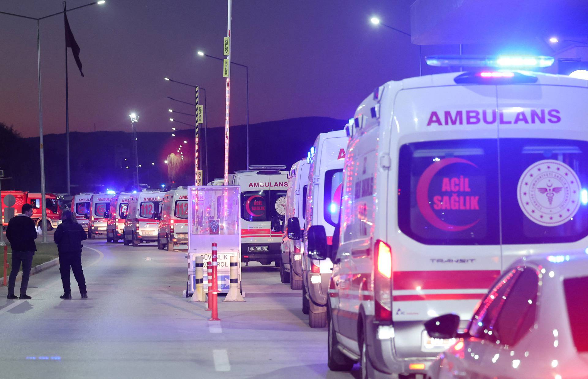 Ambulances line up at the entrance of the headquarters of Turkey's aviation company TUSAS in Ankara