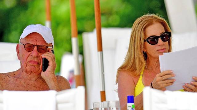 *PREMIUM-EXCLUSIVE* *MUST CALL FOR PRICING* The Australian-American business magnate Rupert Murdoch laps up the hot Caribbean sunshine with his scantily-clad mystery woman and billionaire pal Anthony Bamford out on the beaches of Barbados.