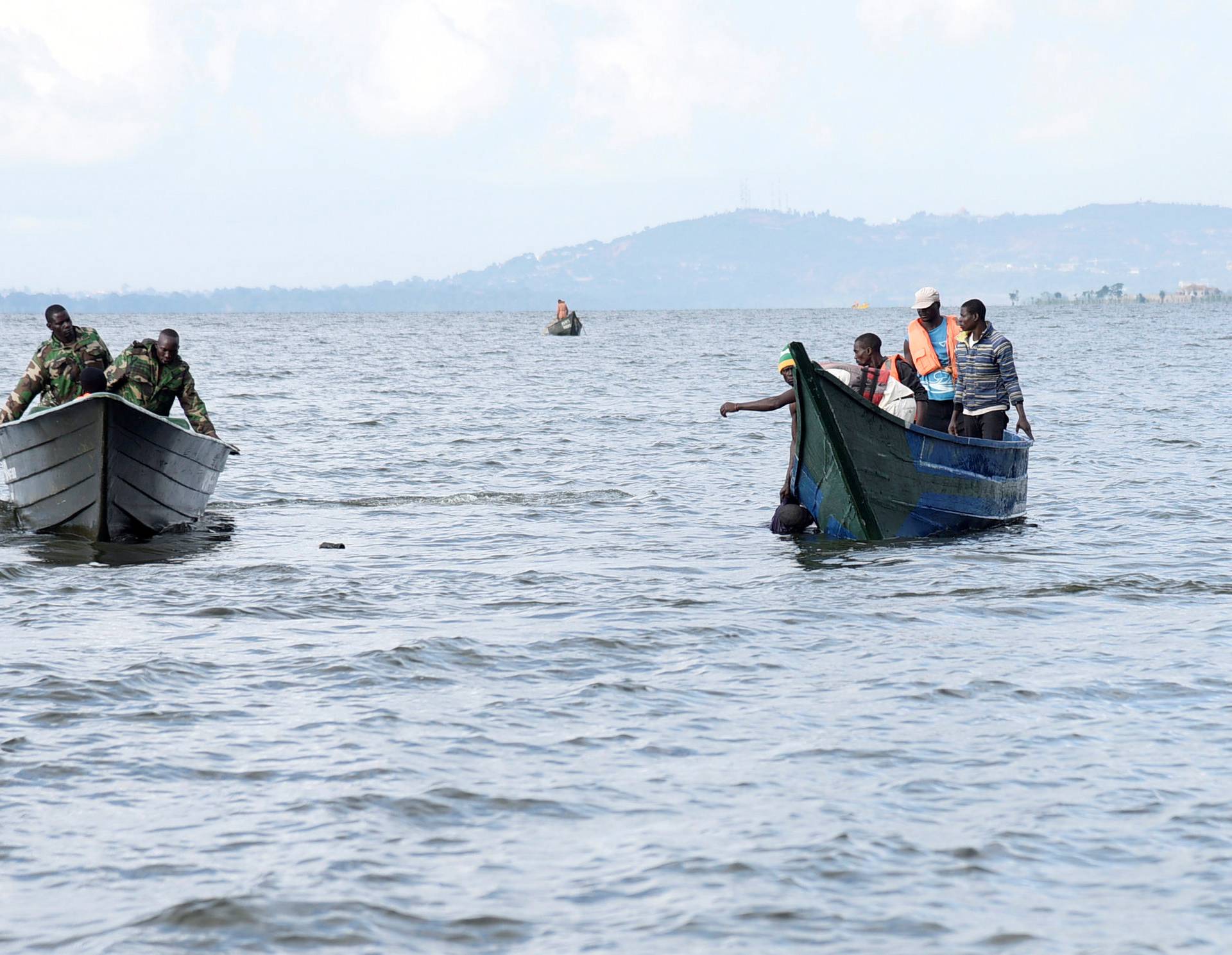 Rescue and recovery missions search for the bodies of dead passengers after a cruise boat capsized in Lake Victoria off Mukono district