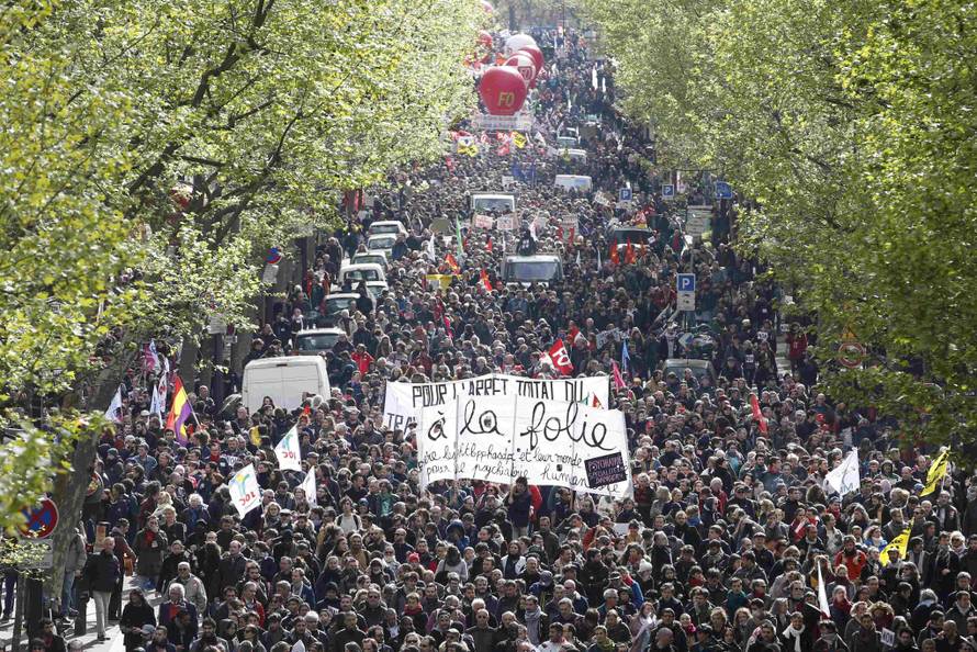 French labour union workers and students attend a demonstration against the French labour law proposal in Paris