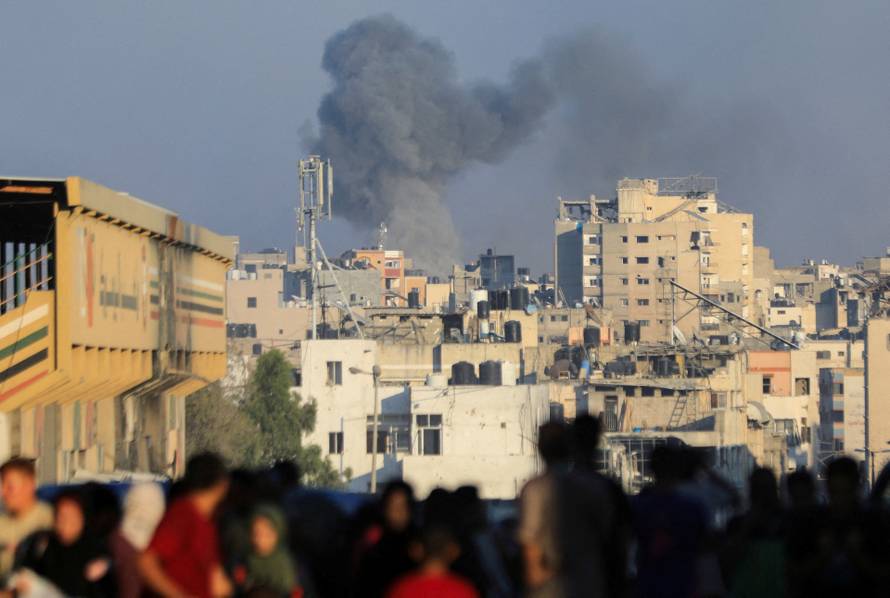 Smoke rises during an Israeli air strike, amid Israel-Hamas conflict, in Gaza City