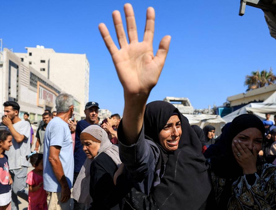 Mourners attend the funeral of Palestinians killed in overnight Israeli airstrikes, in Gaza City