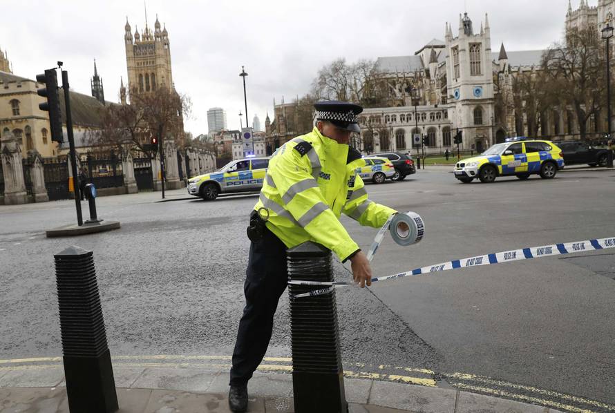 Police tapes off Parliament Square after reports of loud bangs, in London