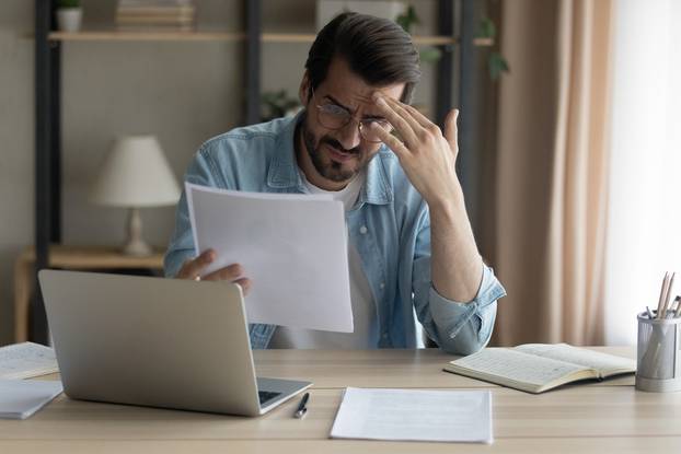 Confused,Shocked,Self,Employed,Businessman,Holding,Paper,Letter,Informing,About