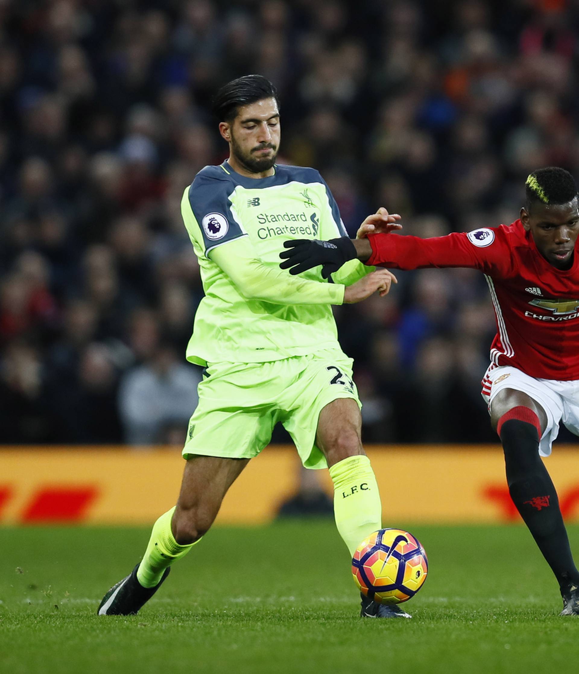 Manchester United's Paul Pogba in action with Liverpool's Jordan Henderson and Emre Can