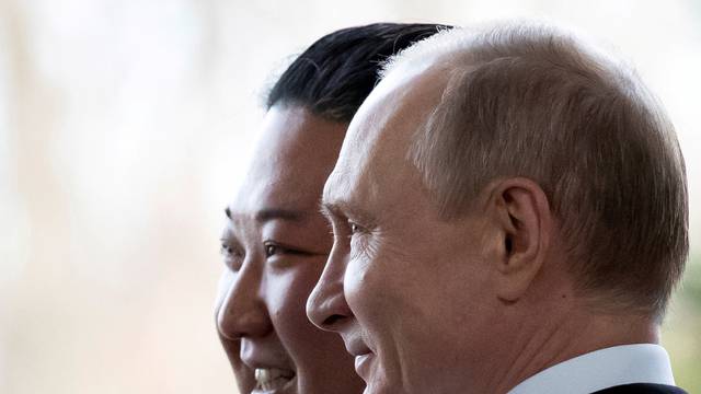 FILE PHOTO: FILE PHOTO: Russian President Vladimir Putin and North Korea's leader Kim Jong Un pose for a photo during their meeting in Vladivostok