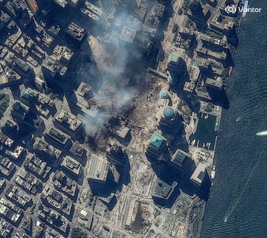 A satellite image shows a plume of smoke rising from the site of the World Trade Center after two planes crashed into the towers, in New York City