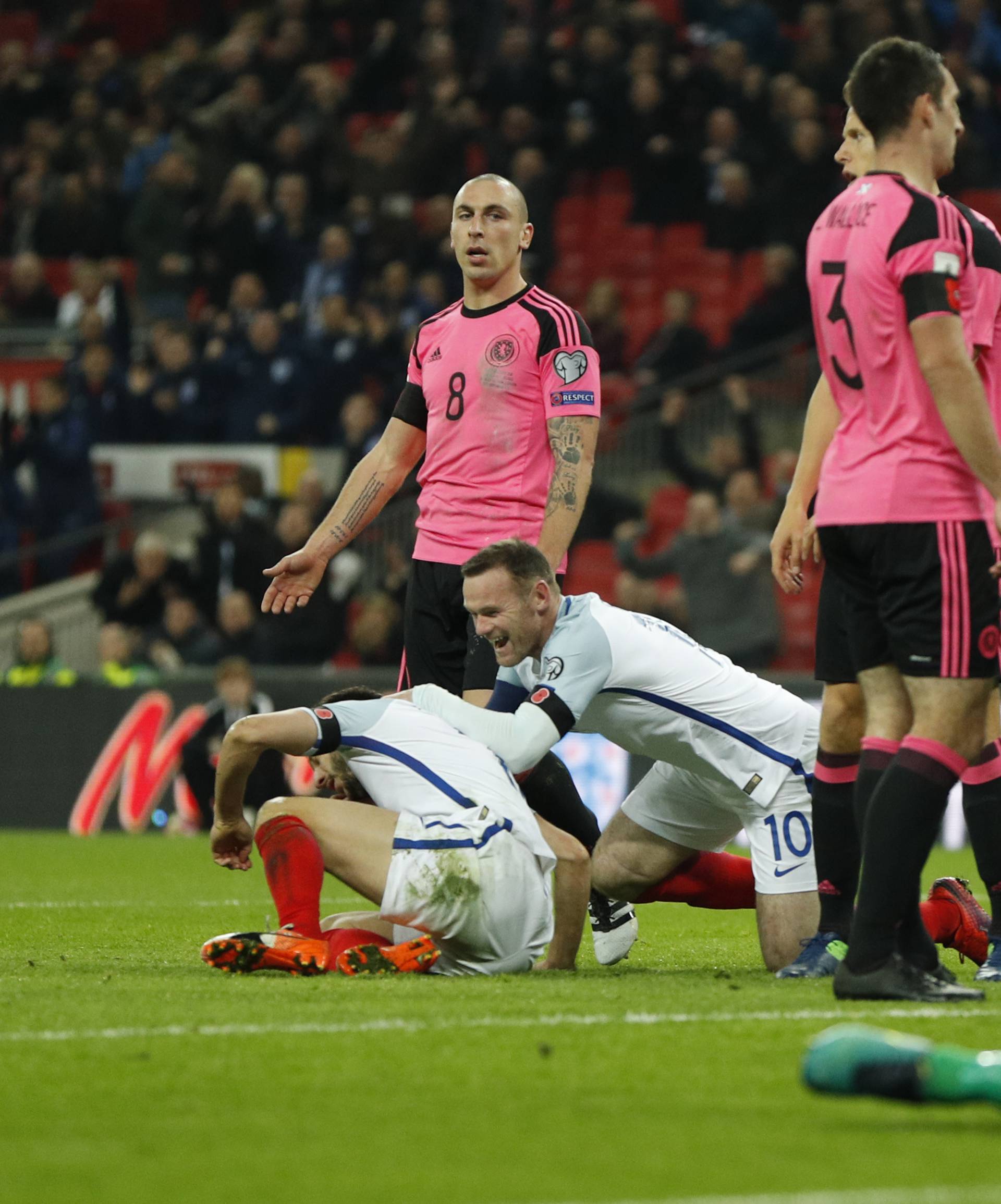 England's Adam Lallana celebrates scoring their second goal with Wayne Rooney