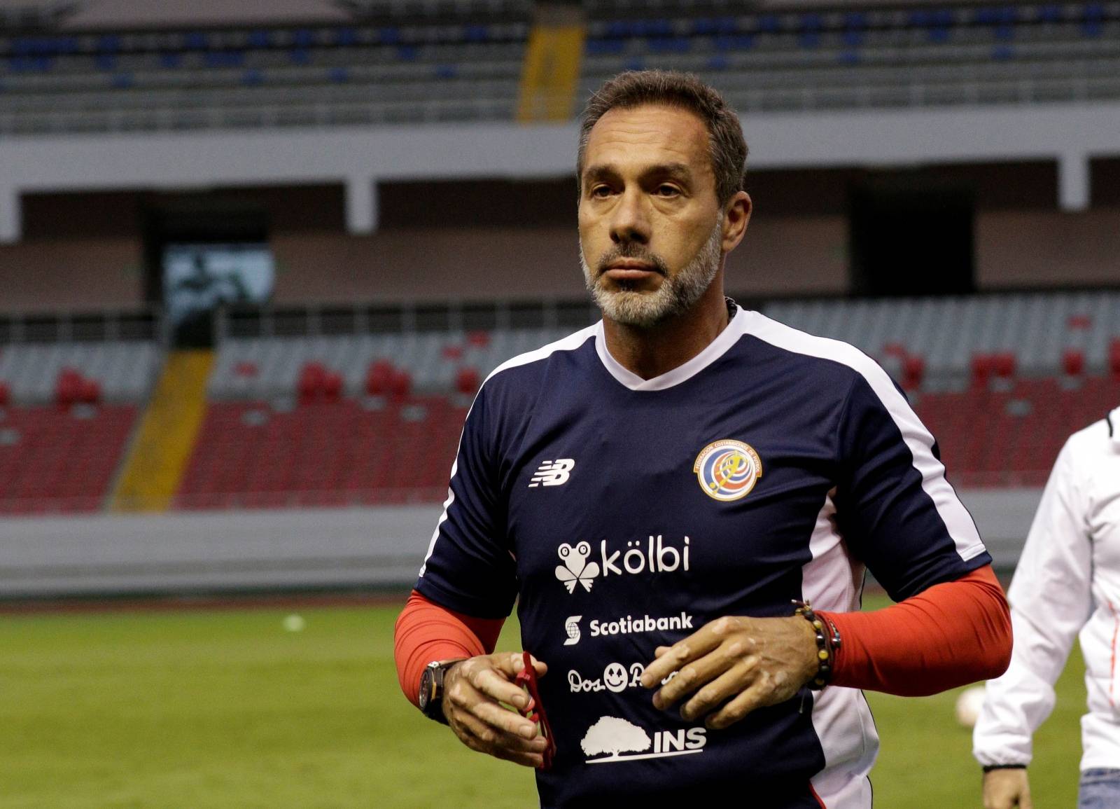 Costa Rica's national team coach Gustavo Matosas leaves the field after informing his players on his resignation at the National Stadium in San Jose