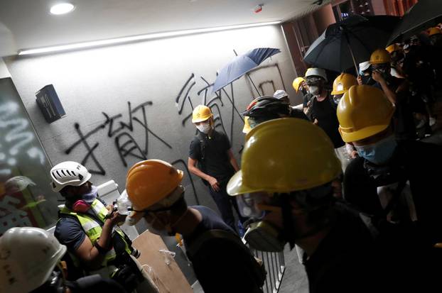 Protesters break into the Legislative Council building during the anniversary of Hong Kong