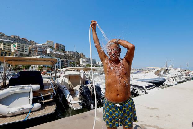 Neapolitans cope with African heat wave as temperatures approach 40 degrees Celsius, in Naples