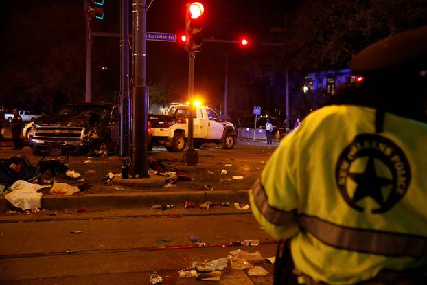 A vehicle is seen crashed along the Endymion parade route at Orleans and Carollton during Mardi Gras in New Orleans, Louisiana