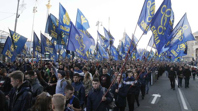 People take part in a procession to mark the Defender of Ukraine Day in Kiev