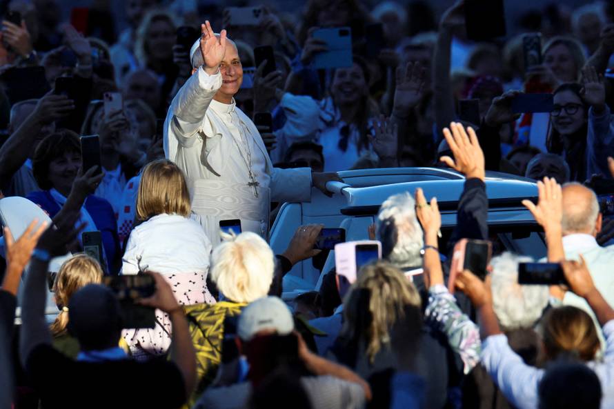 Pope Leo XIV greets the faithful ahead of a Holy Mass presided over by Metropolitan Archbishop of Zagreb Drazen Kutlesa, at the Vatican