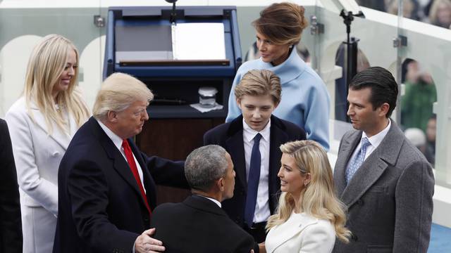 Former U.S. President Barack Obama speaks with Ivanka Trump and other members of the family of U.S. President Donald Trump during inauguration ceremonies in Washington