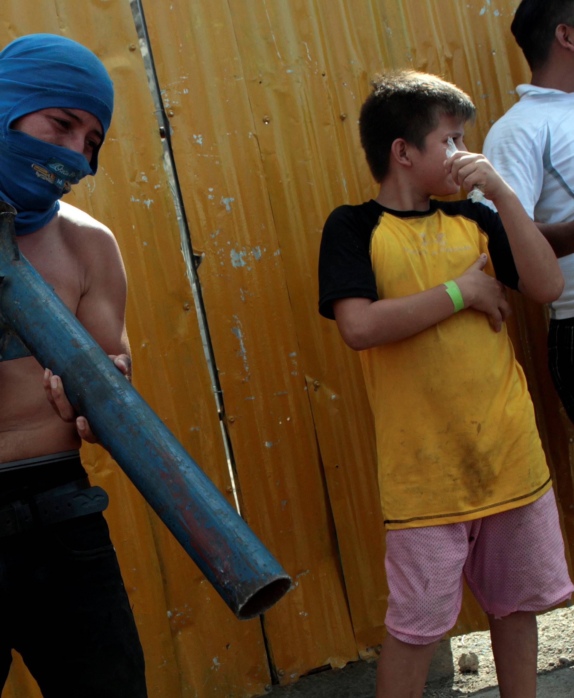 A demonstrator holds a homemade mortar during a protest in Managua