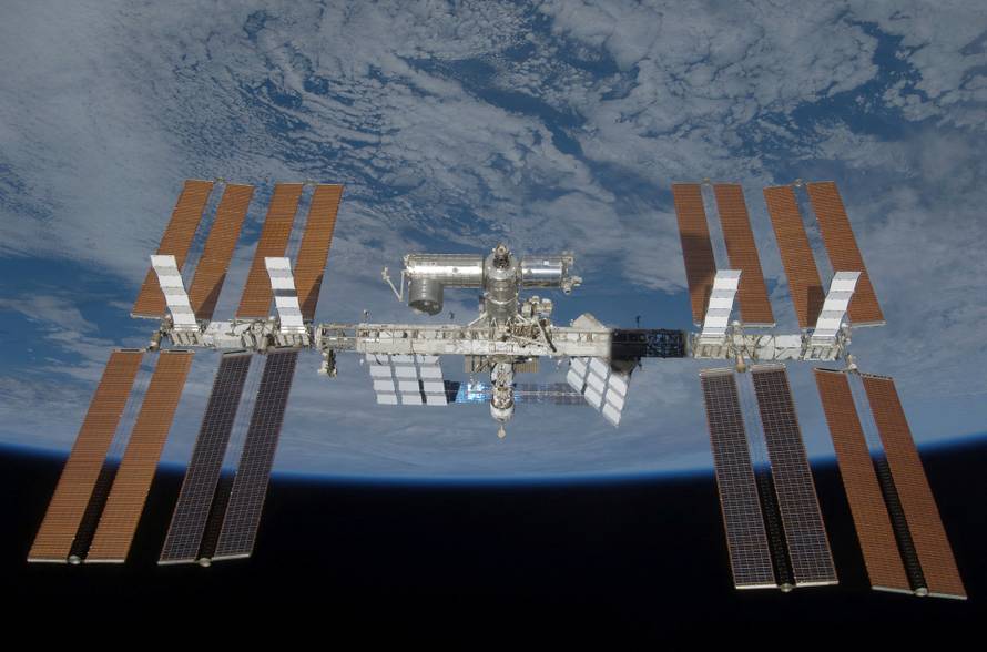 FILE PHOTO: The International Space Station is seen with its full complement of solar arrays from Space Shuttle Discovery during the STS-119 mission