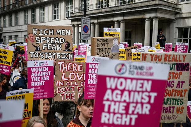 Anti-racism protesters gather to counter anti-immigration rally led by Tommy Robinson, in London