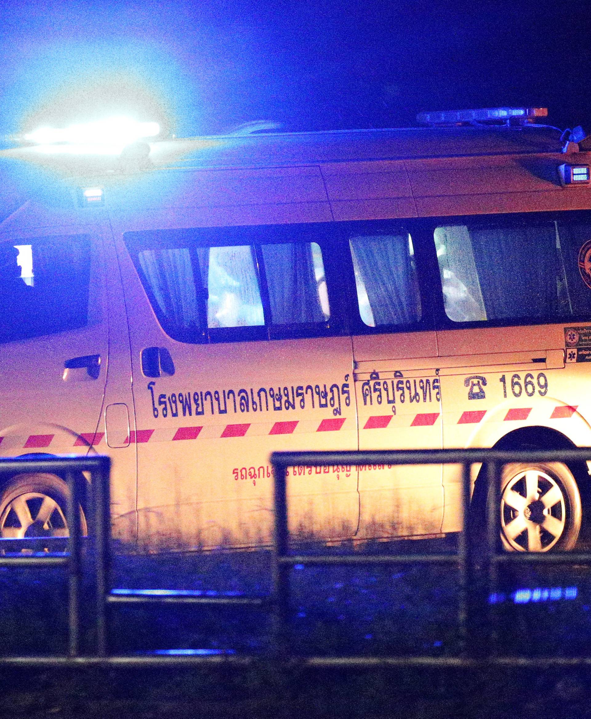 An ambulance carrying rescued schoolboys exits the military airport in the northern province of Chiang Rai