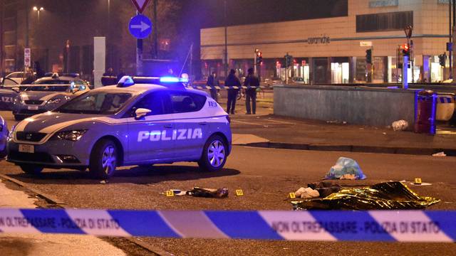 The body of Anis Amri, the suspect in the Berlin Christmas market truck attack, is seen covered by a thermal blanket in a suburb of the northern Italian city of Milan