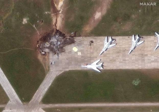 A satellite image shows a destroyed tu 22 aircraft in the aftermath of a drone strika at the Belaya Air Base