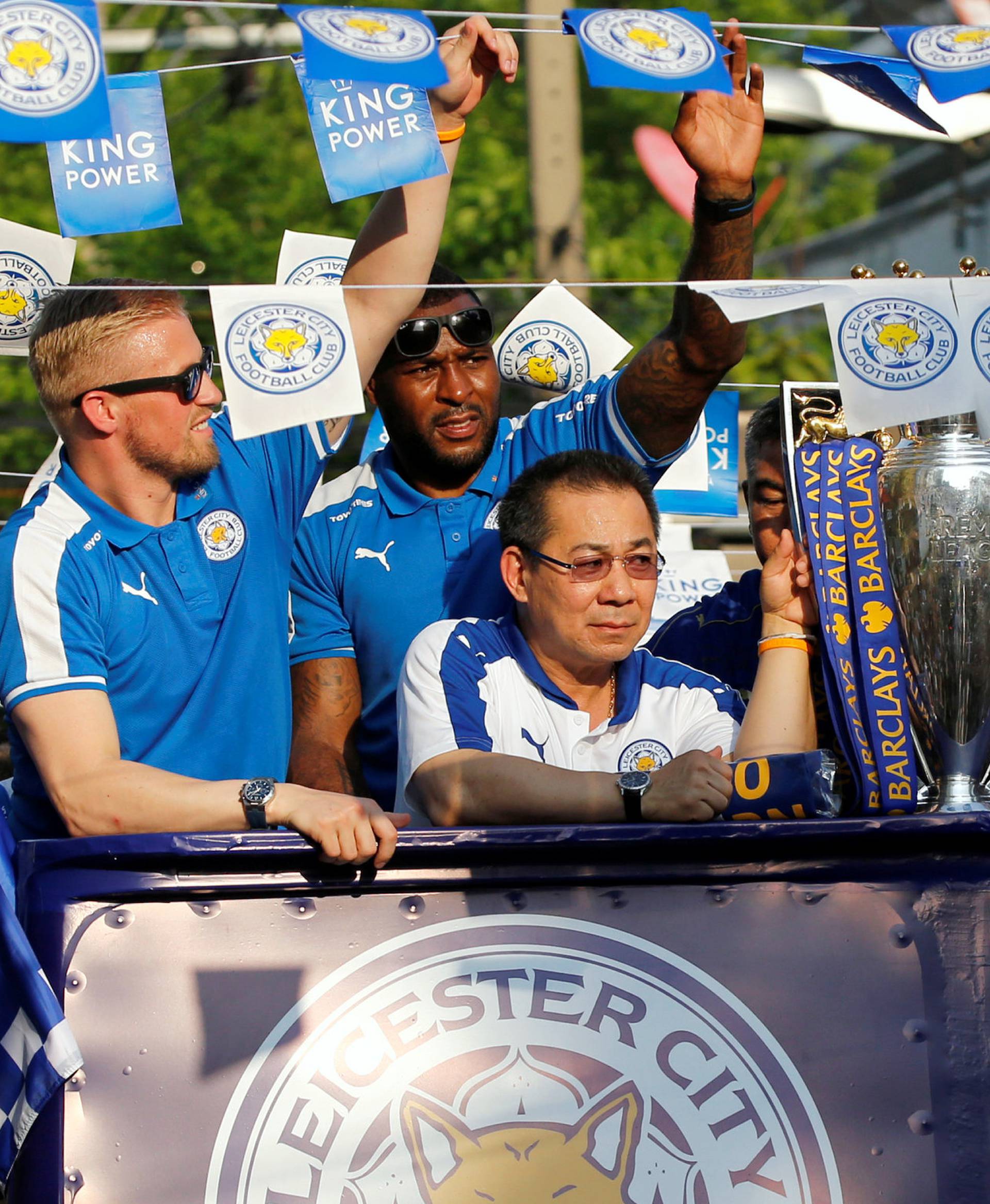 Leicester City soccer club's goalkeeper Schmeichel, captain Morgan and owner Vichai Srivaddhanaprabha are seen during a parade to celebrate club's English Premier League title in Bangkok