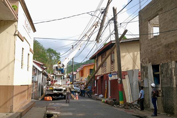 Utility crews restore power lines in a drone photograph after Hurricane Beryl passed passed Grenada