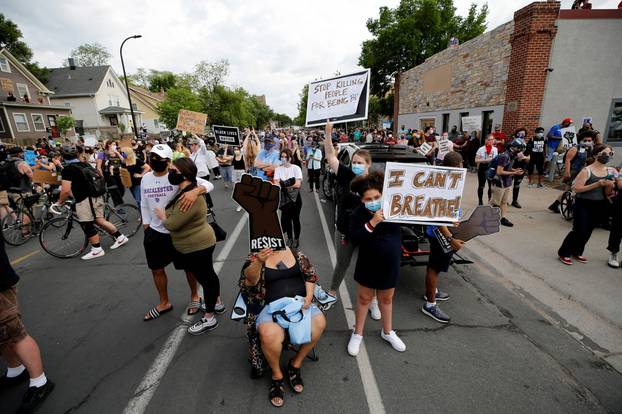 Protesters gather at the scene where Floyd was pinned down by a police officer in Minneapolis