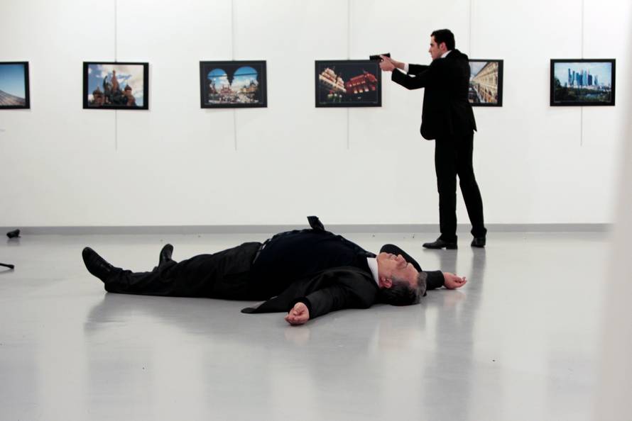 Russian Ambassador to Turkey Andrei Karlov lies on the ground after he was shot by Mevlut Mert Altintas at an art gallery in Ankara
