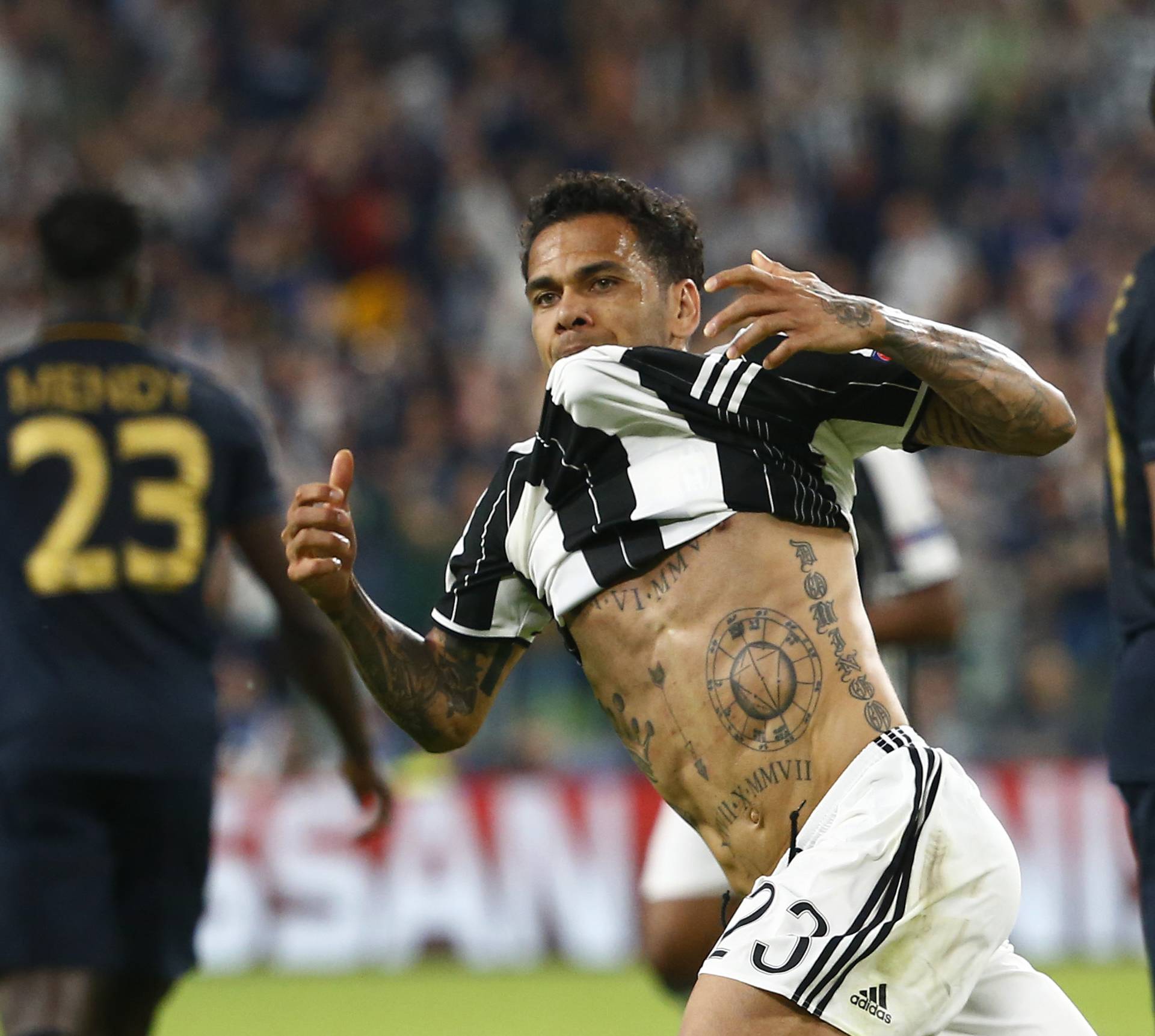 Juventus' Dani Alves celebrates scoring their second goal