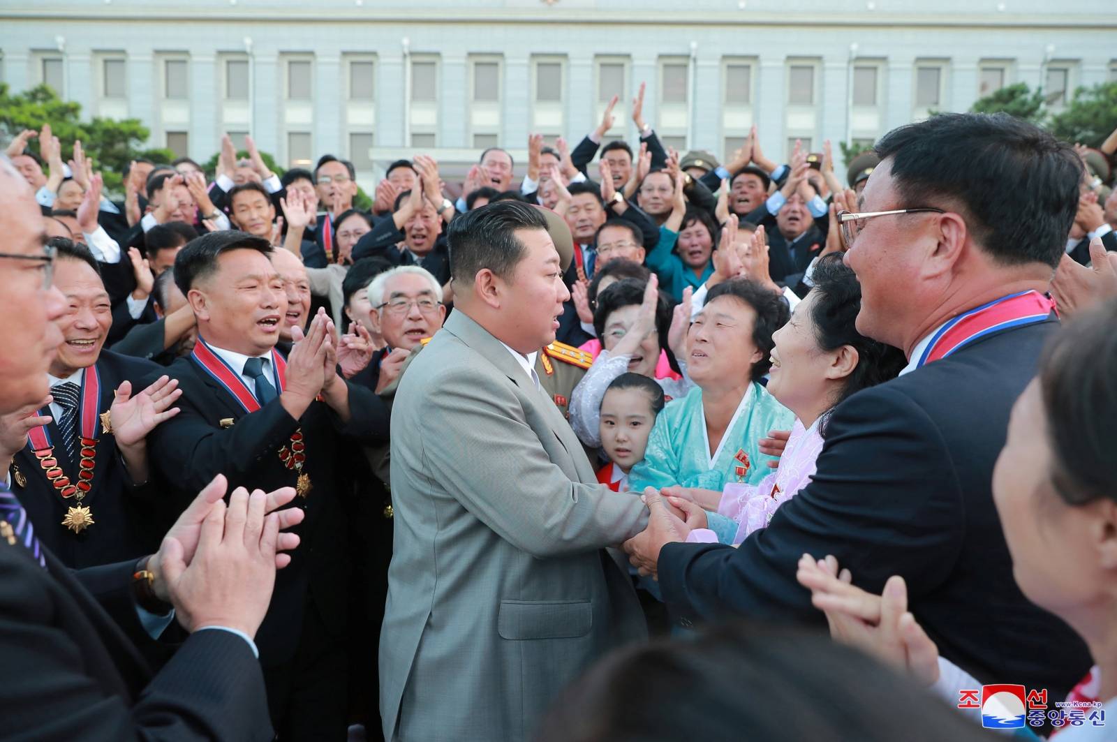North Korean leader Kim Jong Un greets people during an event to mark the 73rd founding anniversary of North Korea in Pyongyang