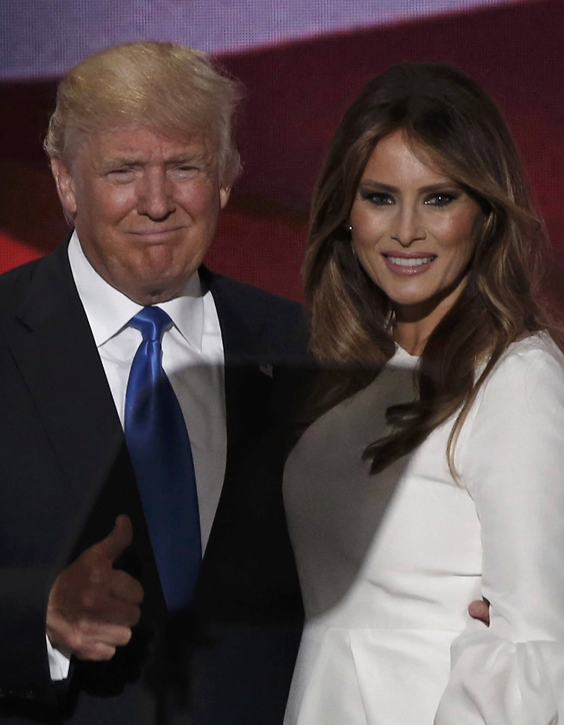 Republican U.S. presidential candidate Donald Trump gives a thumbs up with his wife Melania after she concluded her remarks at the Republican National Convention in Cleveland