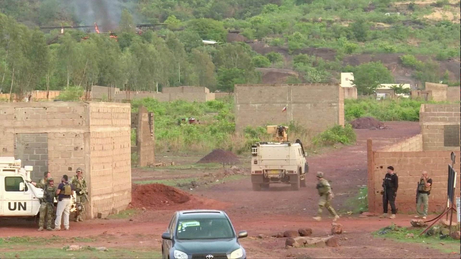 An armoured vehicle drives towards Le Campement Kangaba resort following an attack where gunmen stormed the resort in Dougourakoro, to the east of the capital Bamako, Mali in this still frame taken from video