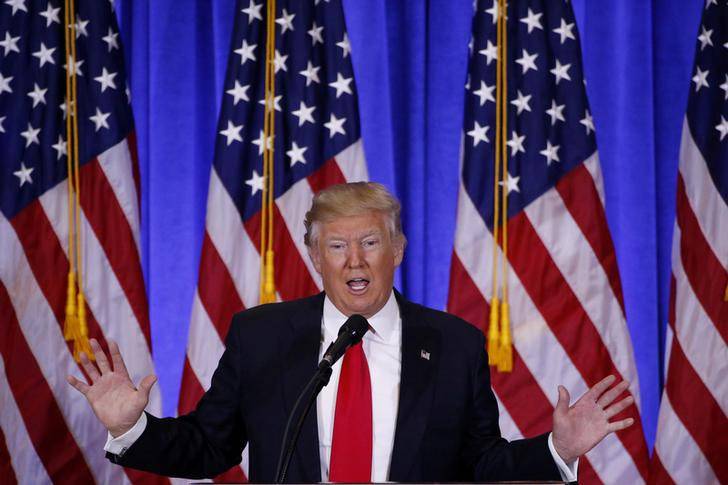 FILE PHOTO: U.S. President-elect Donald Trump speaks during a news conference in the lobby of Trump Tower in Manhattan, New York City
