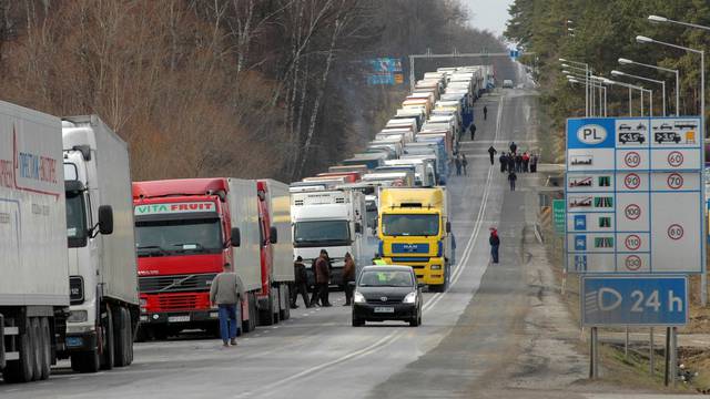 FILE PHOTO: Trucks wait in line on border crossing between Poland and Ukraine in Korczowa